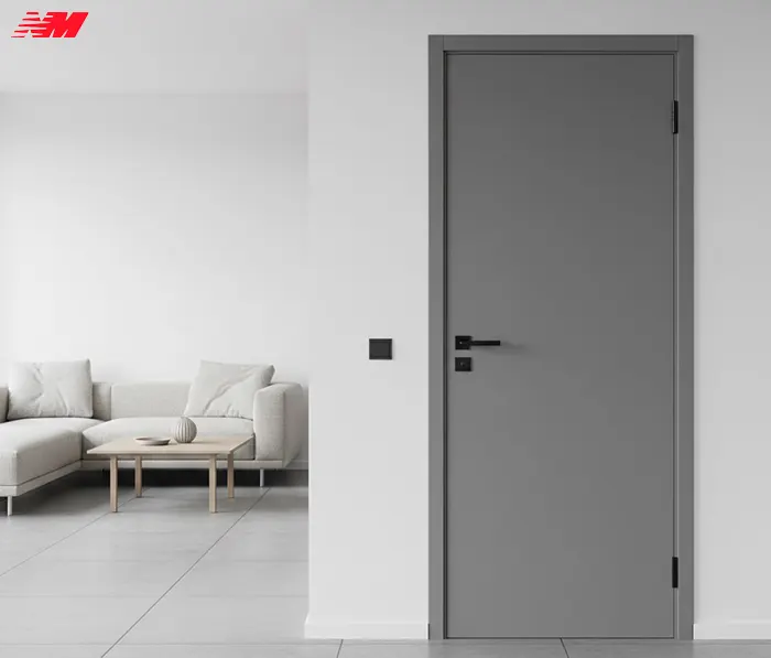Сірі міжкімнатні двері з графітовою фурнітурою в сучасному мінімалістичному інтер'єрі